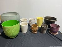 Group shot of all ten planters showing size and color variety