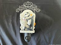Front view of Scentsy Jack Skellington plug-in wax warmer