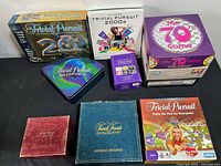 All ten Trivial Pursuit editions laid out