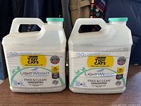 Two unopened jugs front view