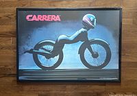 Front view of framed Carrera poster