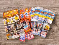 All 12 sealed 1988 baseball rack packs from Topps, Donruss, Score displayed on table