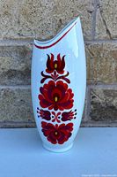 Front view of vase showing full floral design