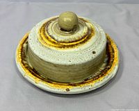 Overall view of butter dish with lid showing glaze and knob handle