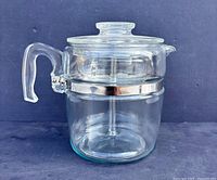 Side view showing assembled glass percolator with lid and handle