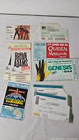 Group shot of all ticket stubs showing performers, colours, condition