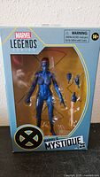 Front of sealed Marvel Legends Mystique box showing figure and accessories