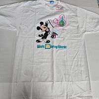 Front view of white Disney 20 Magical Years T-shirt showing full graphic and tags