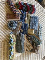 Group of assorted fringe and braid trims on cards