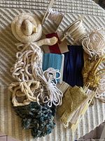 Overview of assorted ropes, cords and fringes on table