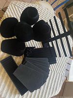 Group shot of all black velvet jewelry displays