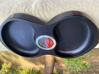 Front view of mahogany double nut dish showing both wells and central fabric inlay