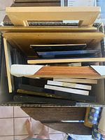 Top view of box showing multiple stacked frames of varying sizes and finishes