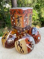 Group shot showing one pillar and three spherical candles with tribal motifs