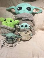 Front view showing all five Grogu items