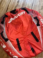 Top view of red Mercury inflatable tube with handles and valve