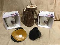 Front view showing birch holder with lid, two Otvia mugs in boxes, yellow and black coin purses