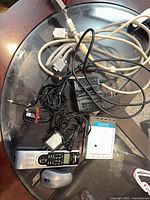 Lot overview showing router, modem, remote, mouse, cables