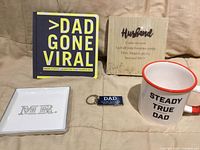 Front view showing book, plaque, tray, keychain, mug