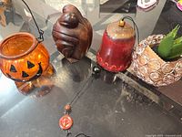 Group shot showing all four decor items on glass table