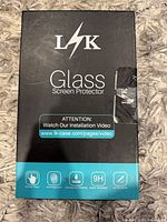 Front of LK Glass Screen Protector retail box showing branding and features
