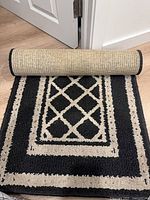 Rug rolled showing backing and front design