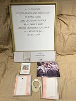 Front view of wood wall sign with other baby gift items displayed