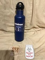 Front view of BottleKeeper with wooden bottle opener and magnet