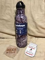 Front view showing BottleKeeper, bottle opener and magnet