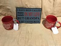 Front view showing both mugs and plaque