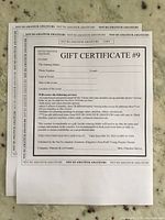 Full view of printed gift certificate showing terms, services included and expiry date