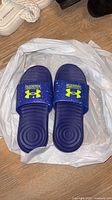 Top view of Under Armour blue youth slide sandals size 2Y