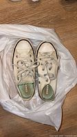 Top view of pair Converse youth sneakers showing condition and style