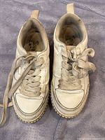 pair of Zara children’s white sneakers front view