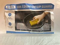Retail insert showing ANZUS sink countertop guard graphic