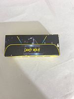 Top view of black/yellow box labelled LIGHT BULB