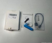 Box, two Bluetooth headsets, micro-USB cable