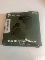 Front of BOMOLOUR floor baby seat cover box showing footprints graphic and product name