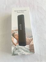 Front of sealed box showing product image and name