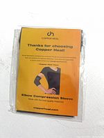 Front of sealed Copper Heal elbow compression sleeve package showing brand and product information