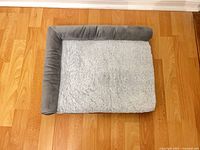 Top view showing entire dog bed, sherpa surface and bolster