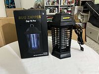 Front of box next to bug zapper showing overall appearance