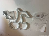 Cherry LED neon light, USB cable with battery box, instruction manual laid out