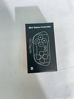 Front of retail box showing outline of controller and Bluetooth icon