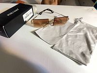 Sunglasses with box, pouch, cloth displayed
