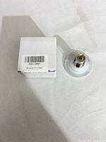 Box with barcode label B0B6ZZMW8P beside chrome drain filter assembly