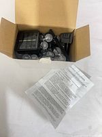 Box containing solar panel, stake, crackle globe LED string, instruction sheet