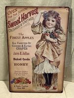 Front of metal sign showing full artwork and text