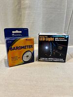 Front view of boxed barometer and LED light