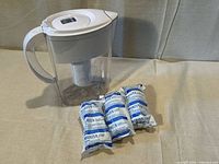 Brita pitcher with three sealed filters displayed
